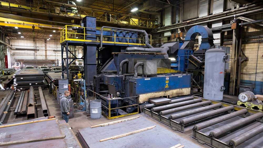 weldall owns a wheelabrator steel plate shot blasting machine to clean material before welding