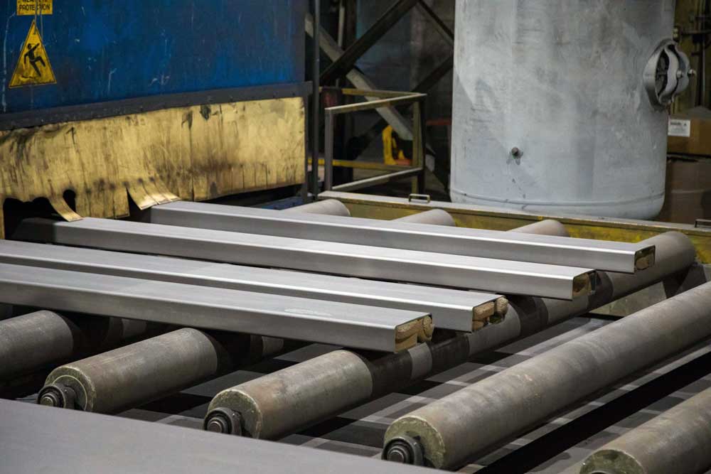 Weldall Manufacturing uses Wheelabrator Pass Thru Blast Machine for structural blasting for weld prep.